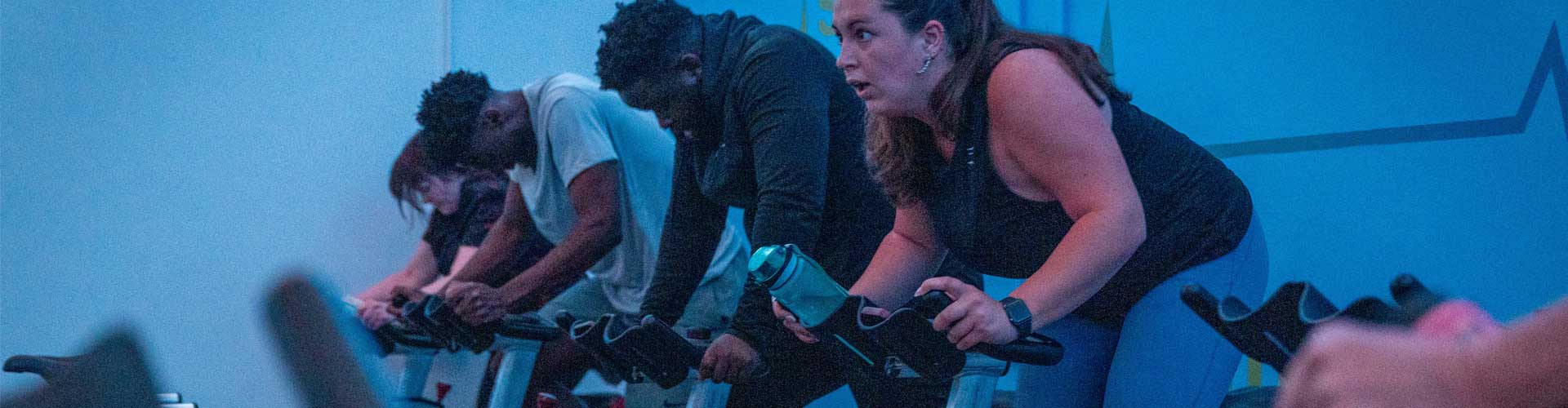 Women and men on spin bikes